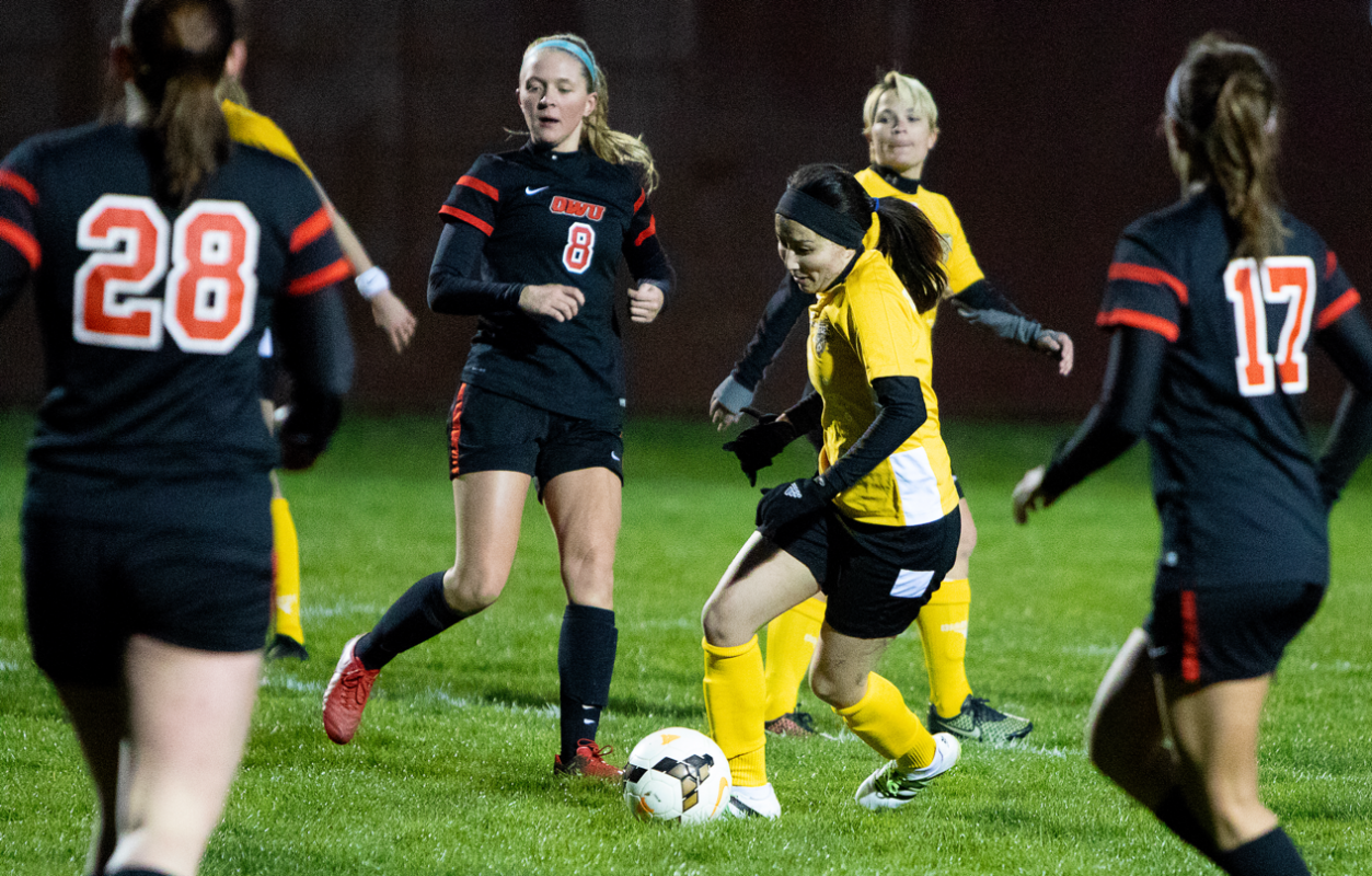 Eagles midfielder Lisa Nouanesengsy dribbles between a bunch of OWU defenders in Columbus's 9-0 win | Daniel Herlensky