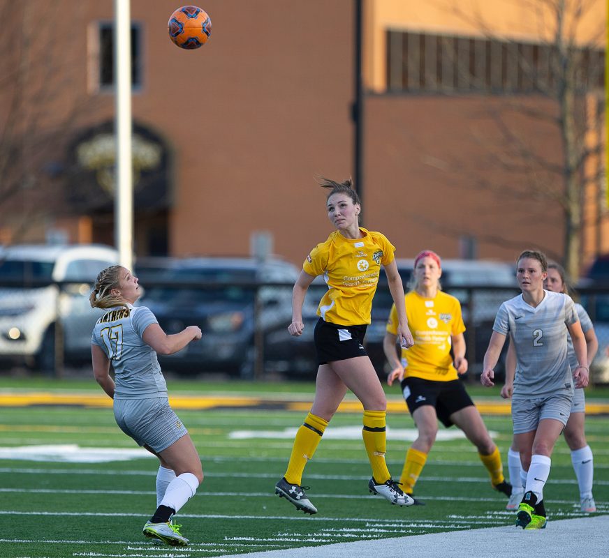 Eagles midfielder Micaela Powers heads the ball along in Columbus's 2-1 win over Ohio Dominican University | Daniel Herlensky