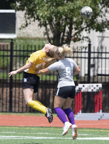 Eagles defender Megan Minnix heads one along | Daniel Herlensky