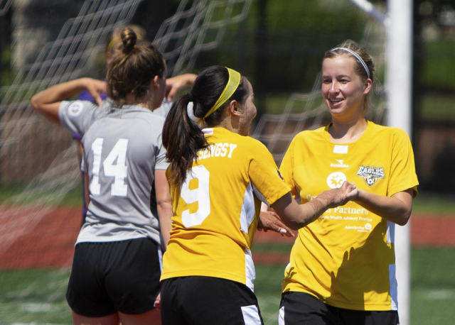 Eagles forward Ellie Gavin (right) congratulates Lisa Nouanesengsy on her great goal to make the score 3-0 | Daniel Herlensky