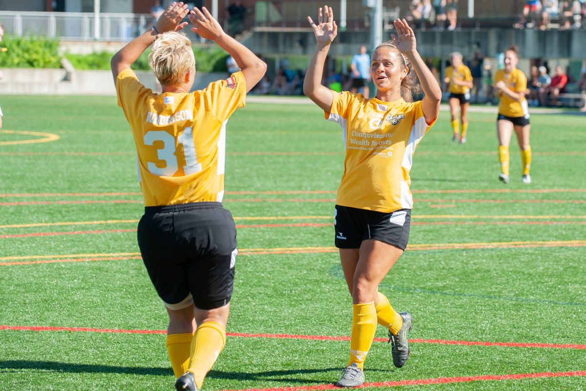 Dani Gunderson (31) congratulates Samantha Damante on her first goal as an Eagle, scored on July 8, 2018, against Steel City FC | Ralph Schudel