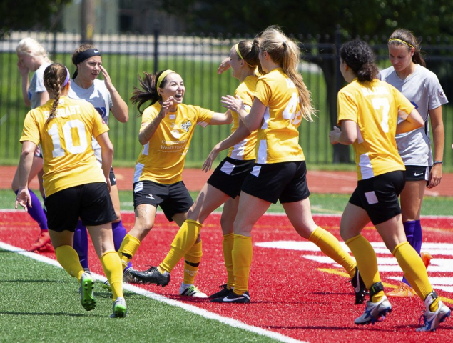 Lisa Nouanesengsy (center) celebrates with captain Amber Kern after Kern's opening goal against Indy Saints FC | Daniel Herlensky