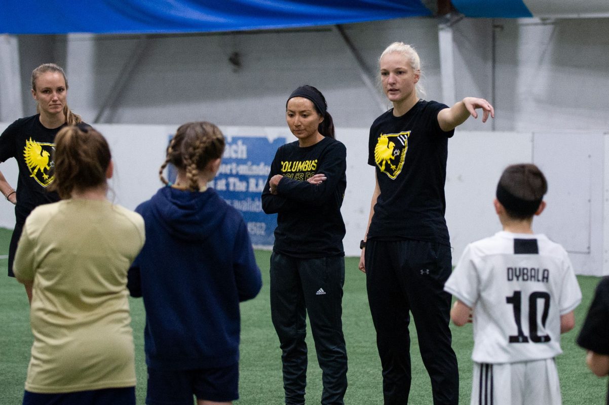 Monique Hanayik - Eagles defender and camps director - started the clinic off by addressing the campgoers at midfield | Ralph Schudel