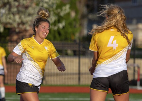 Brooklyn Pritt (left) celebrates her first goal against Otterbein University on April 14, 2019. The Eagles won 5-0. | Daniel Herlensky